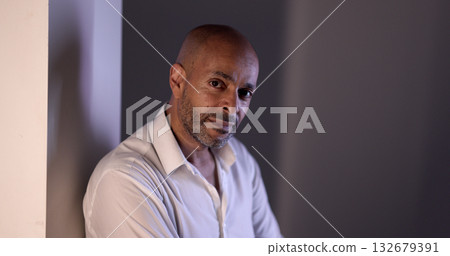 Confident African American businessman posing in modern office environment Confident African American businessman posing in modern office environment 132679391