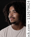 Young african-american man with curly hair looking up and smiling 132679624