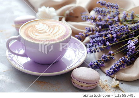 Pastel lavender latte in a cup with macarons and lavender bouquet creates a cozy cafe scene 132680493