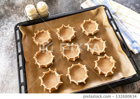 Homemade dough preparation on wooden board with salt and pepper shakers, ready for traditional baking. Ster 4. Homemade dough preparation on wooden board with salt and pepper shakers, ready for traditional baking. Ster 4. 132680634