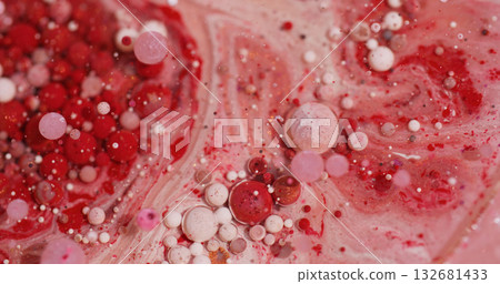 Oil bubbles. Paint fluid. Defocused red pink white colorful sparkling glitter particles flow floating on abstract bokeh art background. Oil bubbles. Paint fluid. Defocused red pink white colorful sparkling glitter particles flow floating on abstract bokeh art background. 132681433