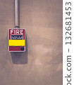 Red fire alarm on concrete wall in modern industrial interior. 132681453