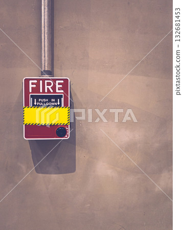 Red fire alarm on concrete wall in modern industrial interior. Red fire alarm on concrete wall in modern industrial interior. 132681453
