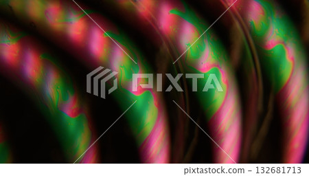 Defocused petroleum stain. Wet abstraction. Pink green neon colorful ink curve droplet liquid bubbles floating on art dark black acrylic background. 132681713