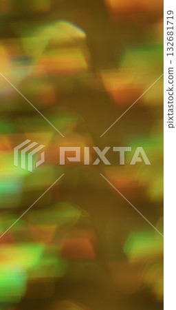 Blur crystal lens. Rainbow leak. Colorful light glow blending on defocused abstract background. Art luminosity orange green texture. Blur crystal lens. Rainbow leak. Colorful light glow blending on defocused abstract background. Art luminosity orange green texture. 132681719