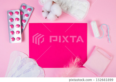 Set of feminine hygiene products for menstruation. Sanitary pads, tampons, pills on pink background. Womens health concept. Copy space. 132681899