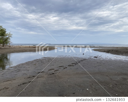 Sandbar is formed at low tide of water waves gently caress warm sand 132681933