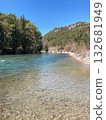 The strong stream of the mountain river comes down from the mountains crystal clear and icy  132681949