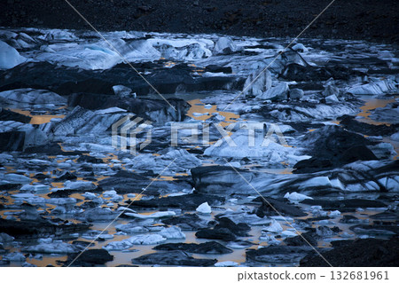 The natural wonder of a glacial lake reflecting golden light 132681961