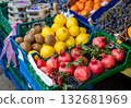 Pomegranates, lemons, kiwis, and grapes on display at a street market. Street vendors sell their fruits 132681969