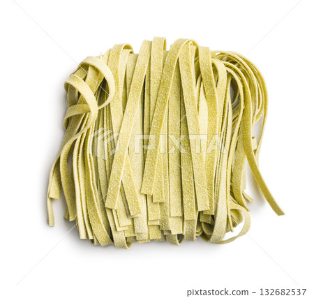 Green tagliatelle pasta isolated on white background. 132682537