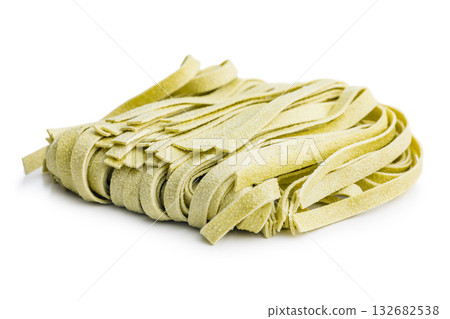 Green tagliatelle pasta isolated on white background. 132682538