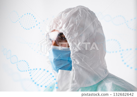 Scientist in protective gear examining DNA structures in a laboratory setting 132682642