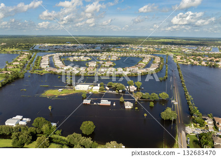 Hurricane rainfall flooded road. Drowned car on city street in Florida residential area. Consequences of hurricane natural disaster 132683470