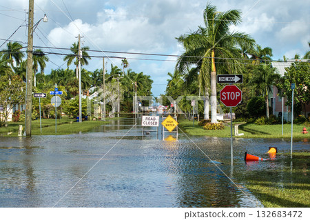 Hurricane Milton flooded street with road closed sign blocking driving of cars in Punta Gorda, Florida. Safety of transportation during natural disaster concept Hurricane Milton flooded street with road closed sign blocking driving of cars in Punta Gorda, Florida. Safety of transportation during natural disaster concept 132683472