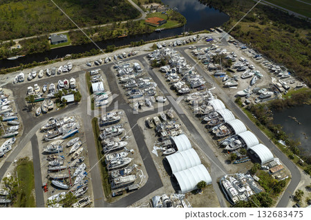 Hurricane Ian destroyed boat station in Florida coastal area. Natural disaster and its consequences Hurricane Ian destroyed boat station in Florida coastal area. Natural disaster and its consequences 132683475