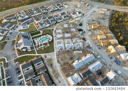 Houses under construction in American suburbs. Development of residential housing. Real estate market in the USA Houses under construction in American suburbs. Development of residential housing. Real estate market in the USA 132683484