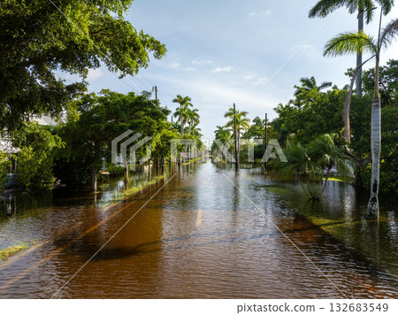 Flooding in Florida caused by tropical storm from hurricane rainfall. Suburb houses in residential community surrounded by flood waters. Aftermath of natural disaster Flooding in Florida caused by tropical storm from hurricane rainfall. Suburb houses in residential community surrounded by flood waters. Aftermath of natural disaster 132683549