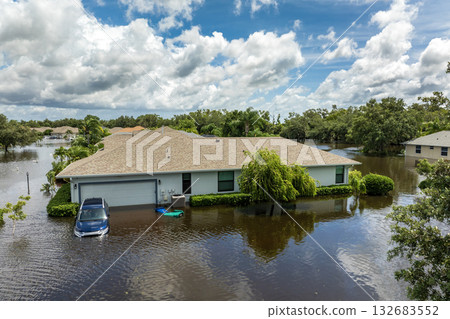Flooded residential area with underwater cars and houses from hurricane Debby rainfall water in Laurel Meadows community in Sarasota, Florida. Aftermath of natural disaster in southern USA Flooded residential area with underwater cars and houses from hurricane Debby rainfall water in Laurel Meadows community in Sarasota, Florida. Aftermath of natural disaster in southern USA 132683552