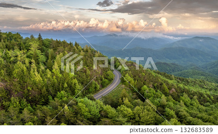 Evening mountain landscape of forest road in North Carolina Appalachians, USA. Blue Ridge Parkway American highway in summer season Evening mountain landscape of forest road in North Carolina Appalachians, USA. Blue Ridge Parkway American highway in summer season 132683589