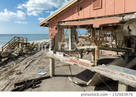 Destroyed houses on ocean shore after hurricane Milton landfall. Natural disaster consequences on Manasota Key, Florida. Storm surge severe damage Destroyed houses on ocean shore after hurricane Milton landfall. Natural disaster consequences on Manasota Key, Florida. Storm surge severe damage 132683678