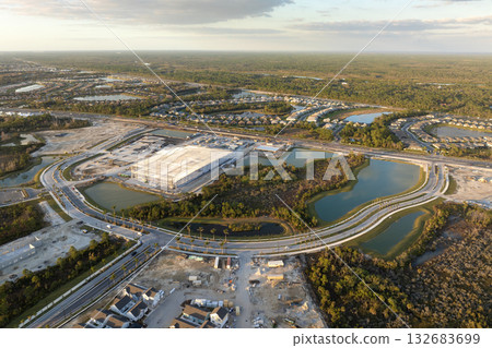 Construction in new developing suburban area. Development of residential housing in American suburbs. Real estate market in the USA Construction in new developing suburban area. Development of residential housing in American suburbs. Real estate market in the USA 132683699