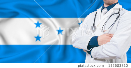 Honduras healthcare concept. Male doctor on Honduras flag. Doctor with crossed arms on Honduras flag Honduras healthcare concept. Male doctor on Honduras flag. Doctor with crossed arms on Honduras flag 132683810