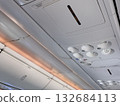 Quiet Airplane Cabin Interior Overhead Console, Reading Lights, Ventilation Controls During Flight 132684113