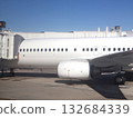 Modern Passenger Jet At Gate With Jet Bridge And Engine Nacelle On Tarmac 132684339