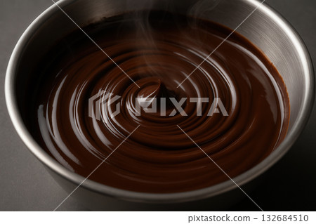 Silky Melted Chocolate Swirl In Metal Bowl With Steam Silky Melted Chocolate Swirl In Metal Bowl With Steam 132684510