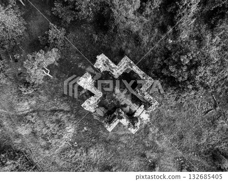 Drone view of the Chapel of the Exaltation of the Holy Cross ruins in Bristev. Surrounded by nature, the structure’s remains provide a glimpse into the past and evoke a sense of history. 132685405
