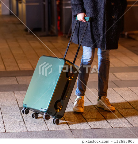 A collection of luggage on a city street. 132685903