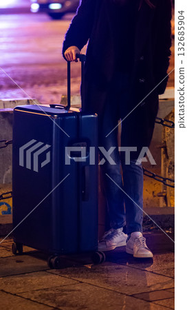 A collection of luggage on a city street. 132685904