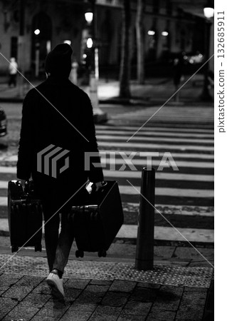 A mysterious traveler with two suitcases. A mysterious traveler with two suitcases. 132685911