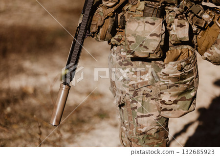 A soldier in camouflage and tactical gear. Concept for modern warfare, defense, and global security 132685923