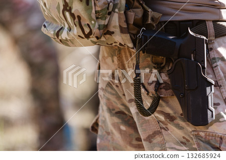 A soldier's pistol in a tactical holster. A soldier's pistol in a tactical holster. 132685924