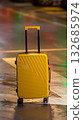 A bright suitcase on an arrow. Concept for the journey, a new direction, and standing out 132685974