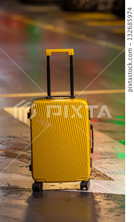A bright suitcase on an arrow. Concept for the journey, a new direction, and standing out 132685974