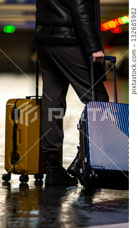 A traveler with colorful luggage. 132685982