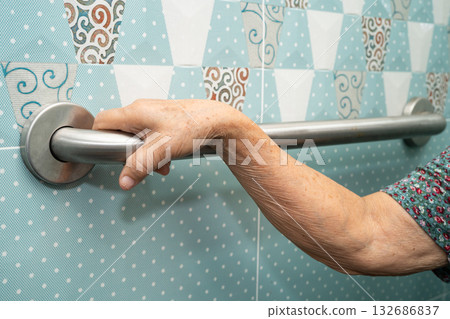 Asian elderly woman patient use toilet bathroom handle security in nursing hospital, healthy strong medical. Asian elderly woman patient use toilet bathroom handle security in nursing hospital, healthy strong medical. 132686837