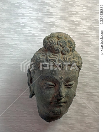 A Buddha head sculpture on display at a museum in Taxila, an ancient city in Pakistan east of Gandhara 132686883