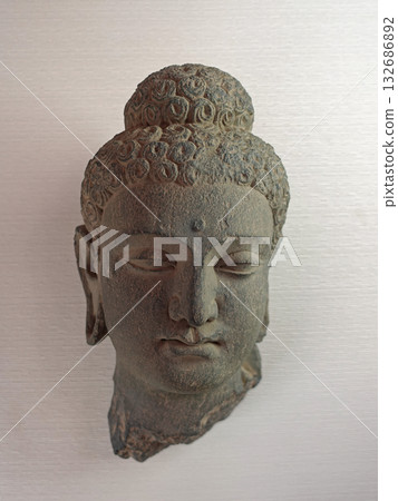A Buddha head sculpture on display at a museum in Taxila, an ancient city in Pakistan east of Gandhara 132686892