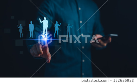 Businessman using digital screen for recruitment and HR selection with candidate profile icons, job application process, talent management, human resources technology and employee hiring concept. 132686958