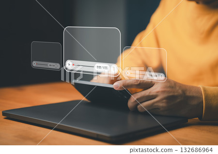 Streaming and online video concept. A person using a smartphone with media player interfaces, symbolizing digital content, social media, video streaming platforms and modern multimedia technology. 132686964