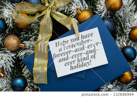Greeting card with HOPE YOU HAVE A REMEMBER FOREVER AND EVER KIND OF HOLIDAY text on handmade Christmas wreath. Festive mood new year celebration. Postcard decoration decor 132686994