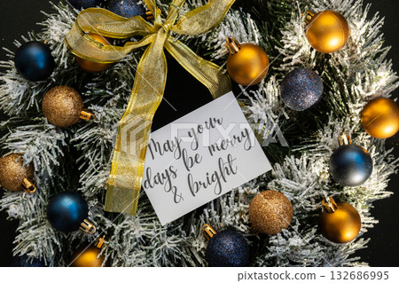 Greeting card with text MAY YOUR DAYS BE MERRY AND BRIGHT on handmade Christmas wreath. Festive mood new year celebration. Postcard decoration decor 132686995
