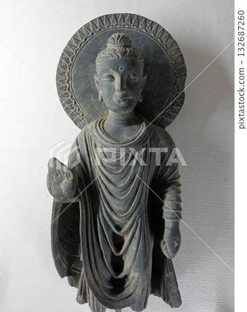 A standing Buddha statue on display at the Taxila Museum in eastern Pakistan, a historic site in the Gandhara region of Buddhist art 132687260