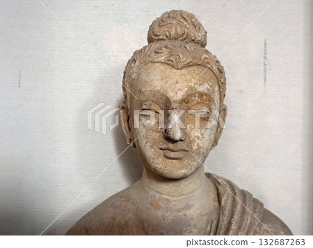 A standing Buddha statue on display at the Taxila Museum in eastern Pakistan, a historic site in the Gandhara region of Buddhist art 132687263