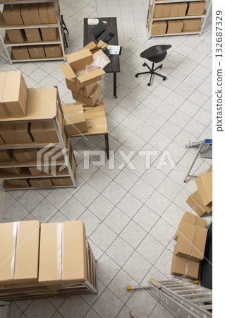 Empty workstation highlighting e commerce retail process in a small business depot, space used for in house inventory management, order processing and express delivery logistics. 132687329
