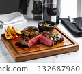 Well-done Wagyu beef steak, served on the wood tray with red wine 132687980